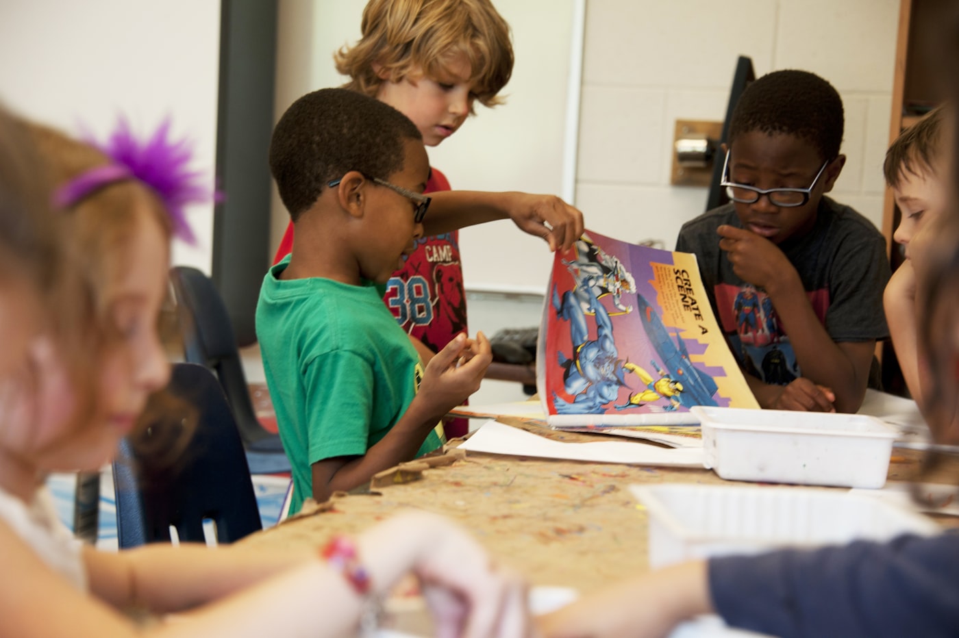 Small homeschool group working together at a centre table