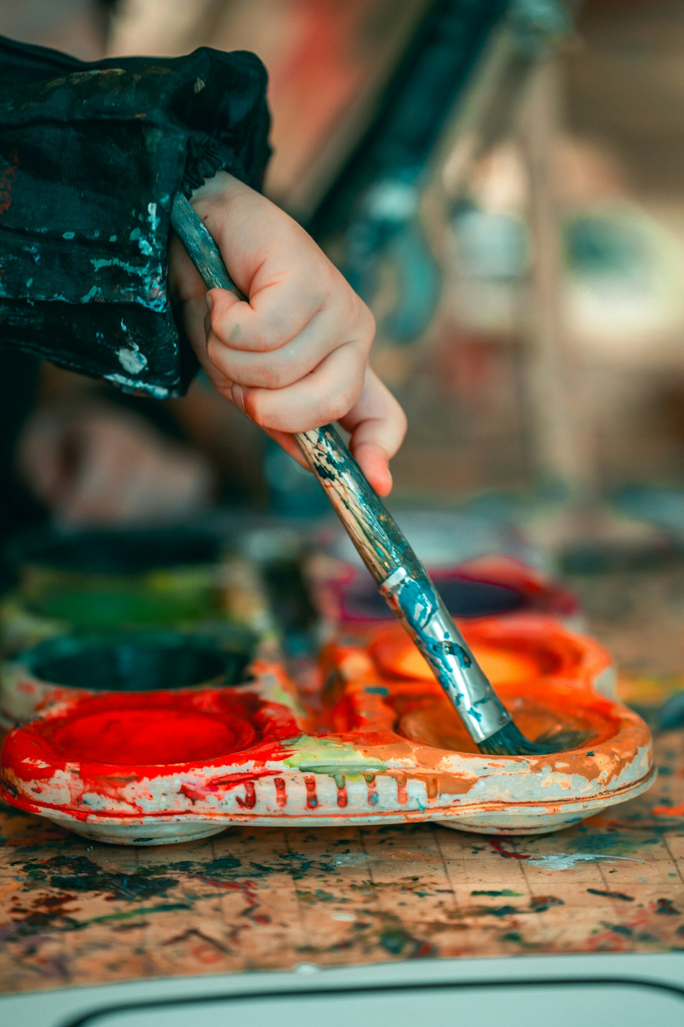 Paint palette and brush close-up in art class