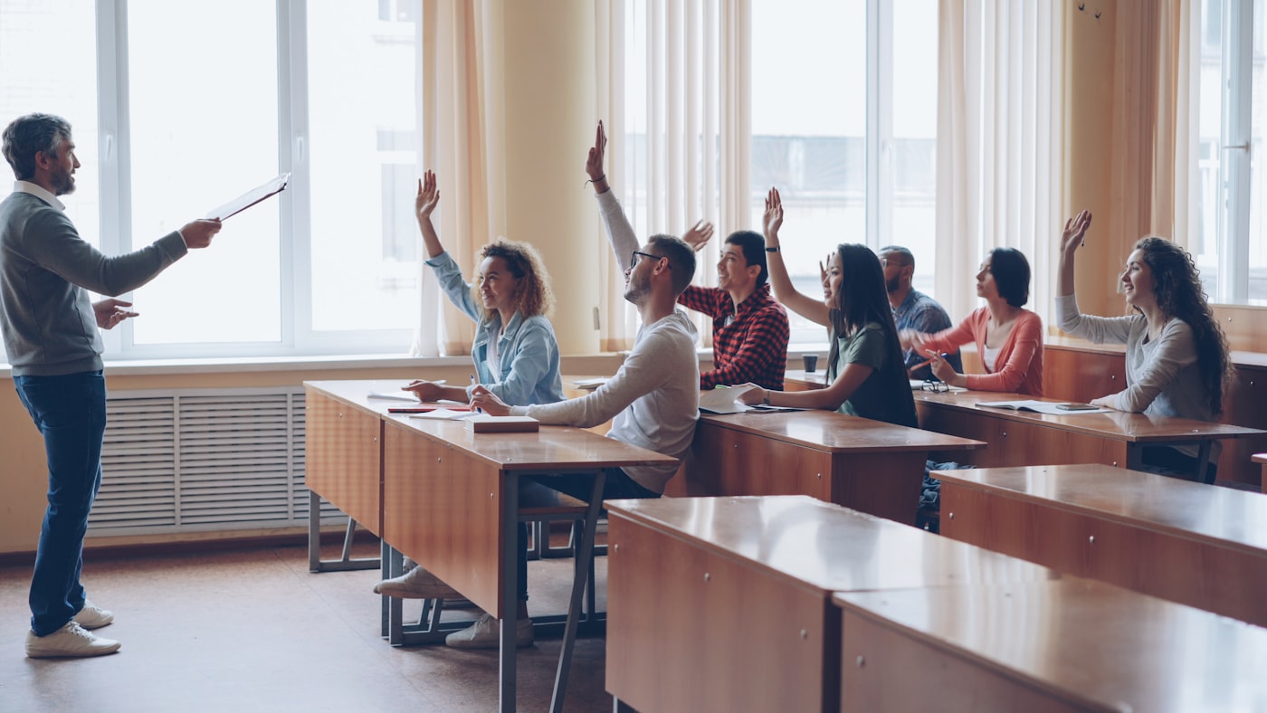 Spelling bee practice, students raising hands