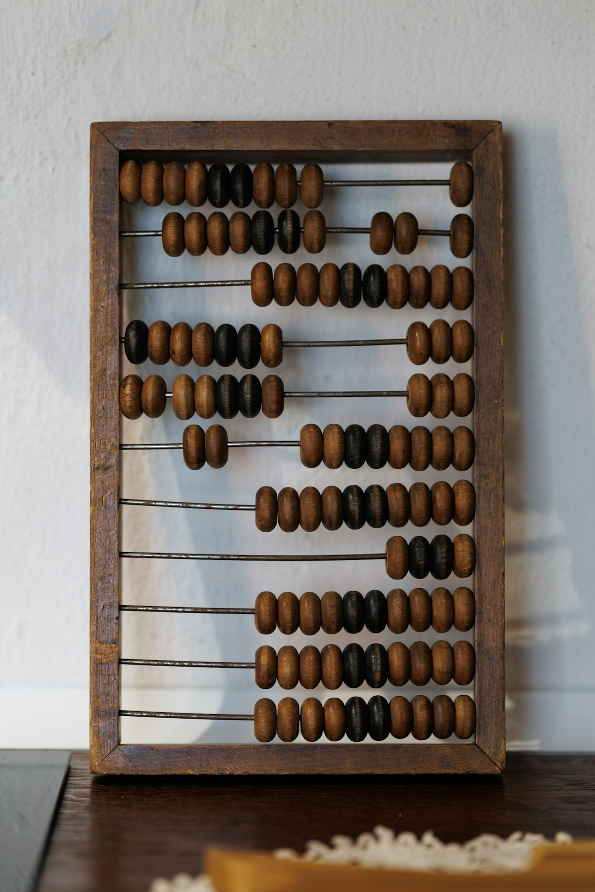 Soroban abacus with brown beads, mental maths practice