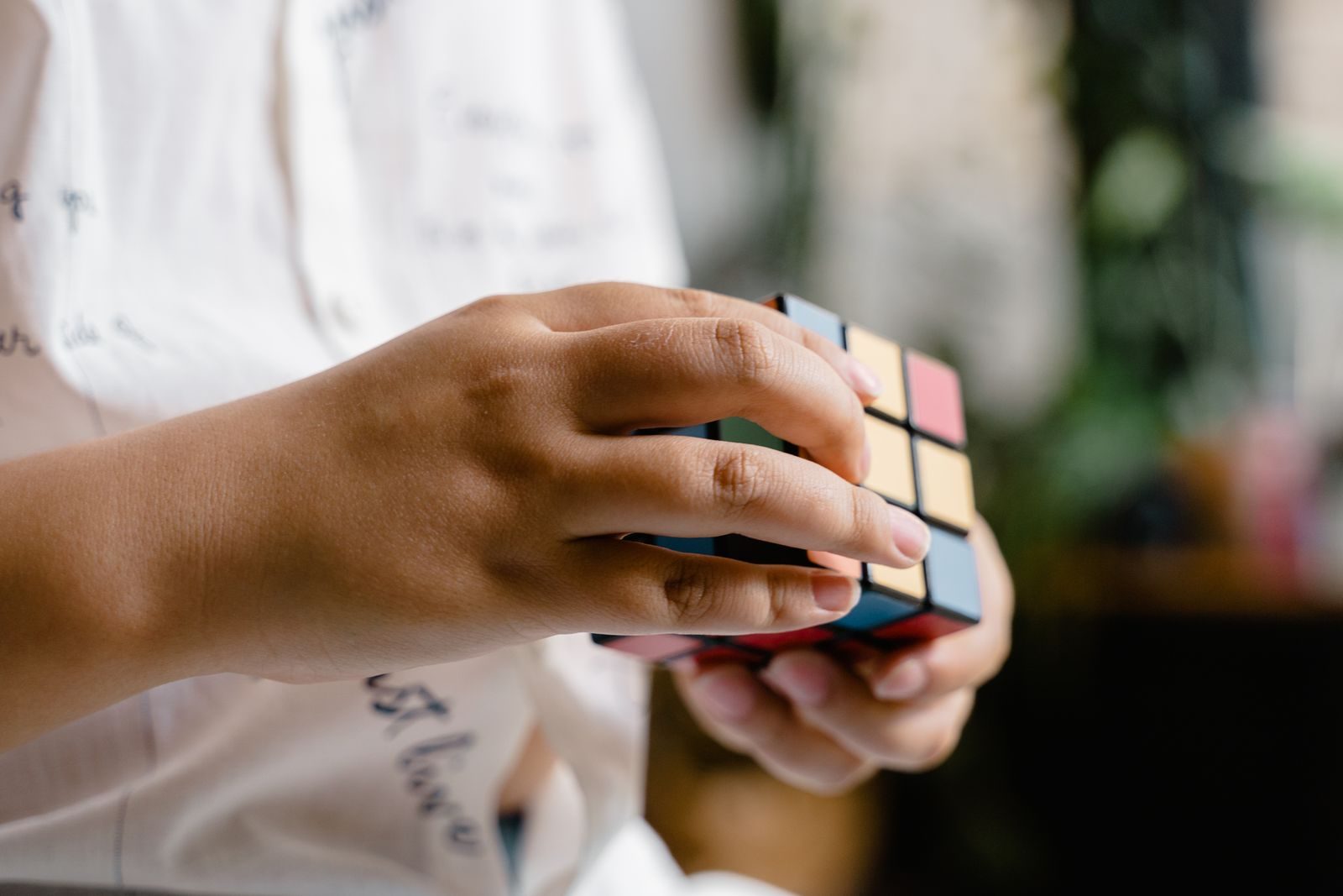 Hands turning a Rubik's cube close-up